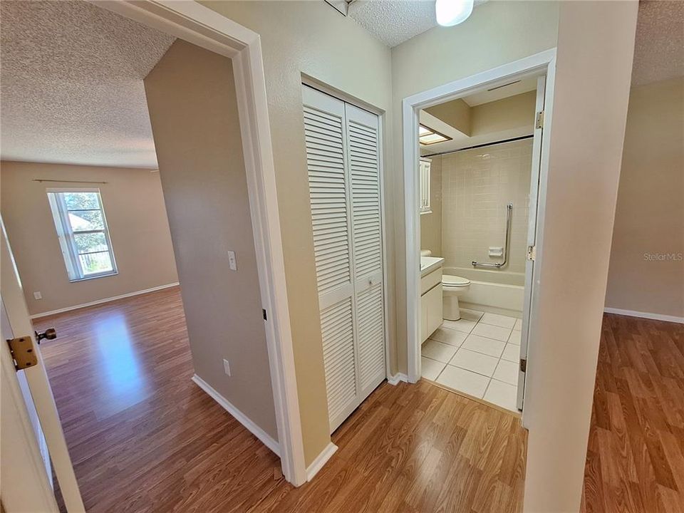 Hall bath conveniently located between main living and guest suite~