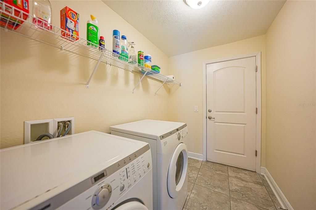 LAUNDRY ROOM FLOWS INTO GARAGE