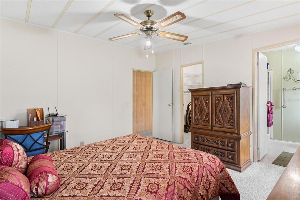 Master Bedroom with view into Walk-in closet on left and view of Master Bath on right