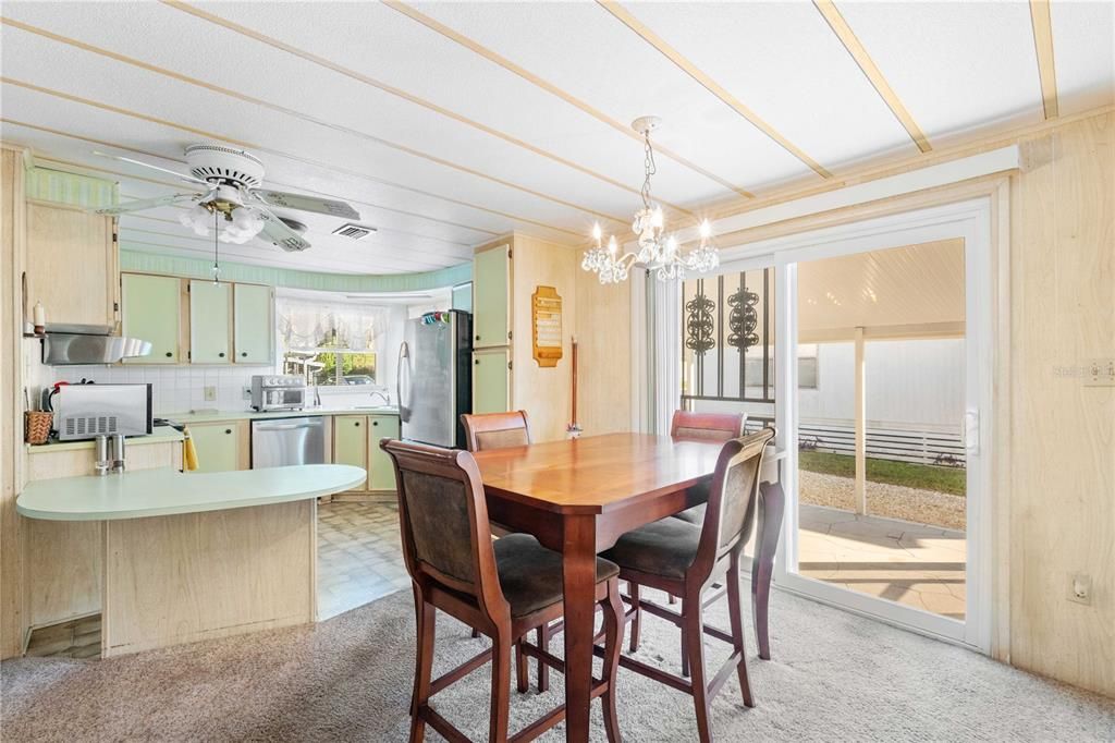 Sliding door into dining room from carport.