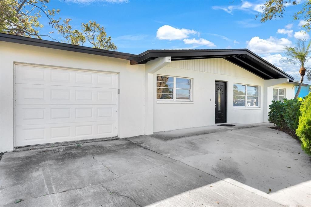 Ranch-style home featuring a garage