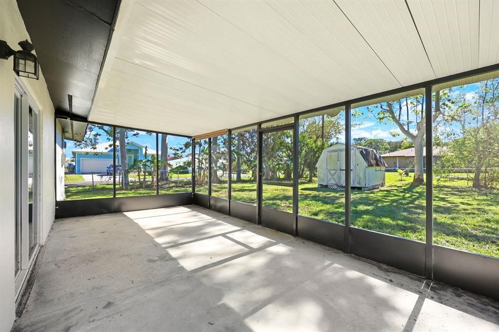 Unfurnished sunroom featuring a wealth of natural light