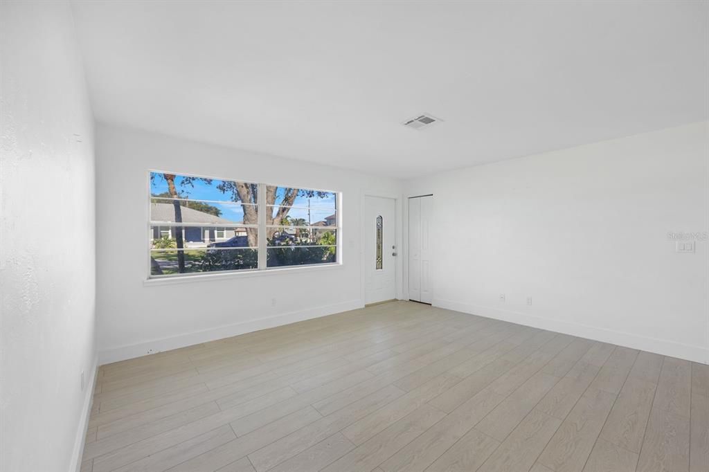 Unfurnished room with light hardwood / wood-style flooring