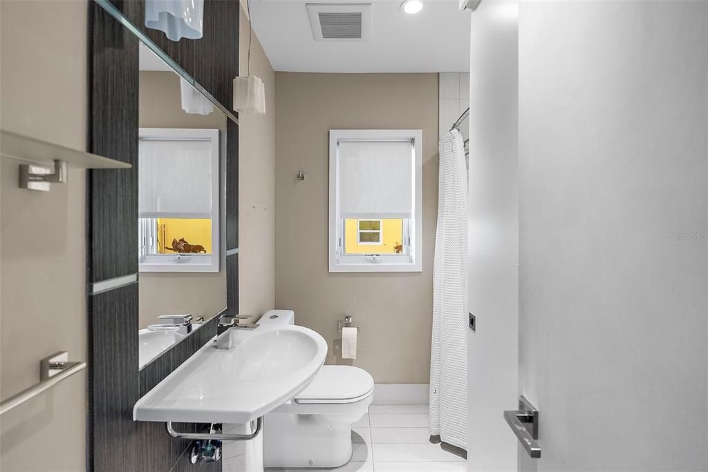 Bathroom shared by 2 bedrooms