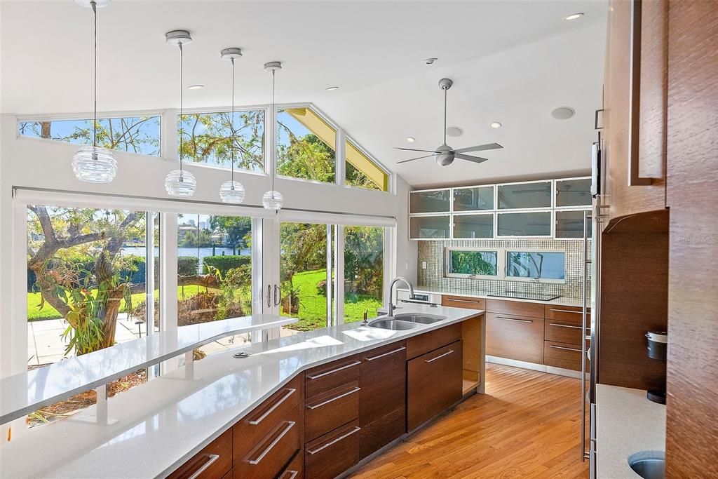 Quartz countertops on huge island. Fabulous light filled room with a water view.