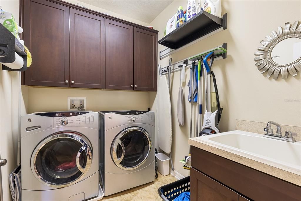 Primary suite walk in closet has 80+ shoe storage racks.