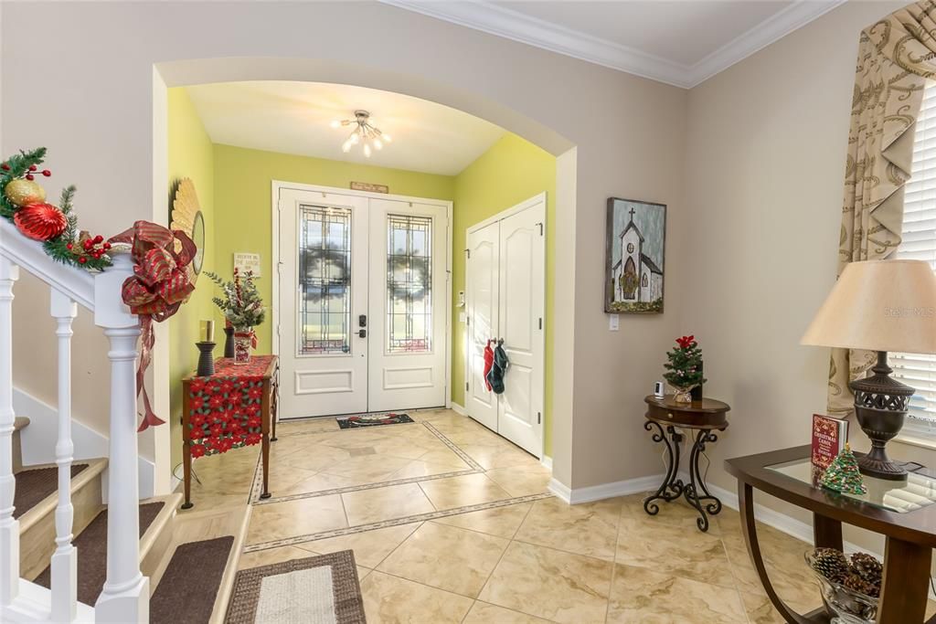 Stunning foyer with a closet for storage.