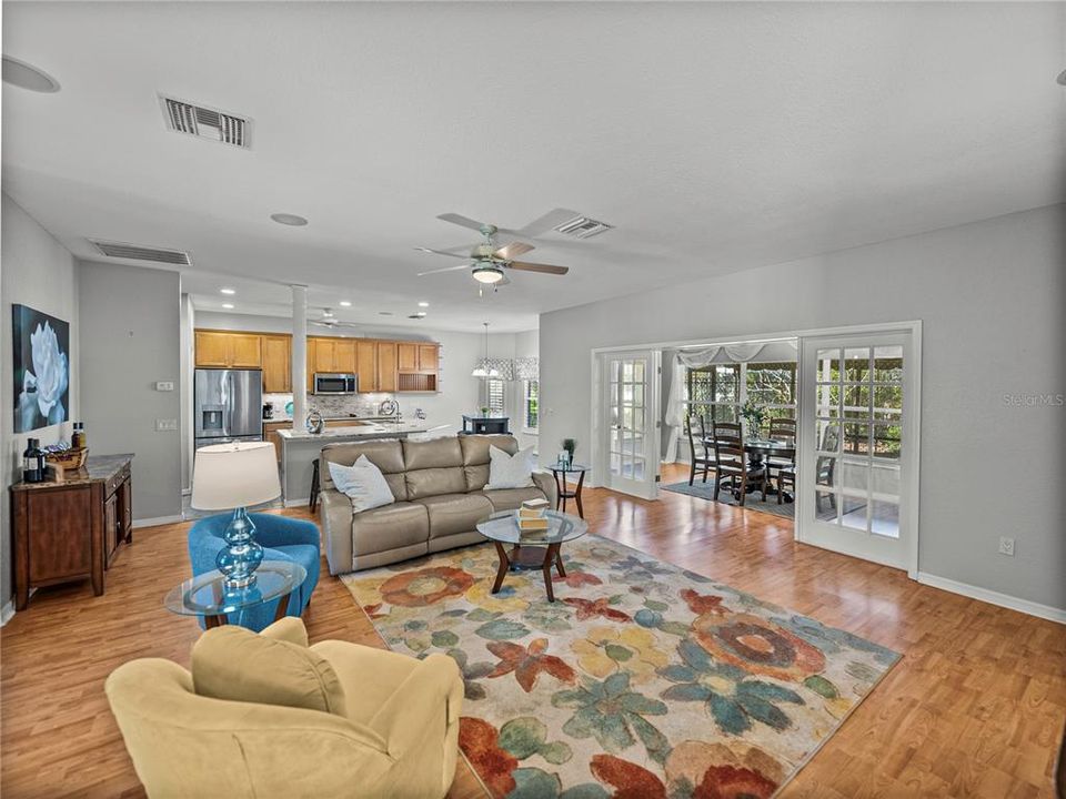 Huge living room with french doors leading into Florida room