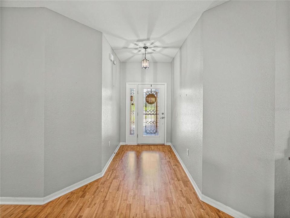 Foyer at entrance with beautiful beveled glass on front door for privacy yet natural light