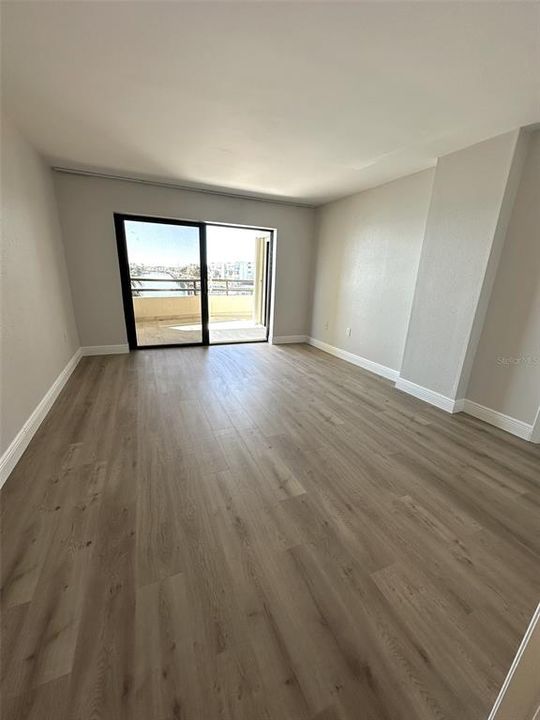 Primary Bedroom with patio doors out to balcony