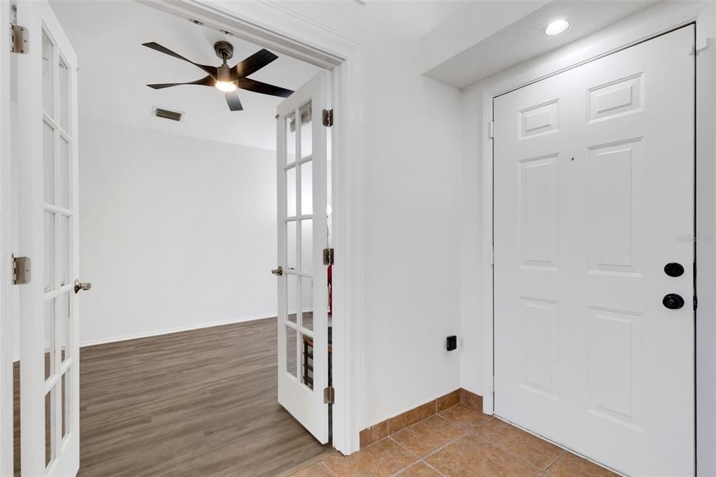 Beautiful French doors lead to sunny office.