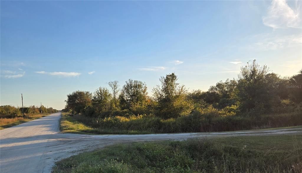 Front corner of  NW 208th St. and to the right on NW 274th St.