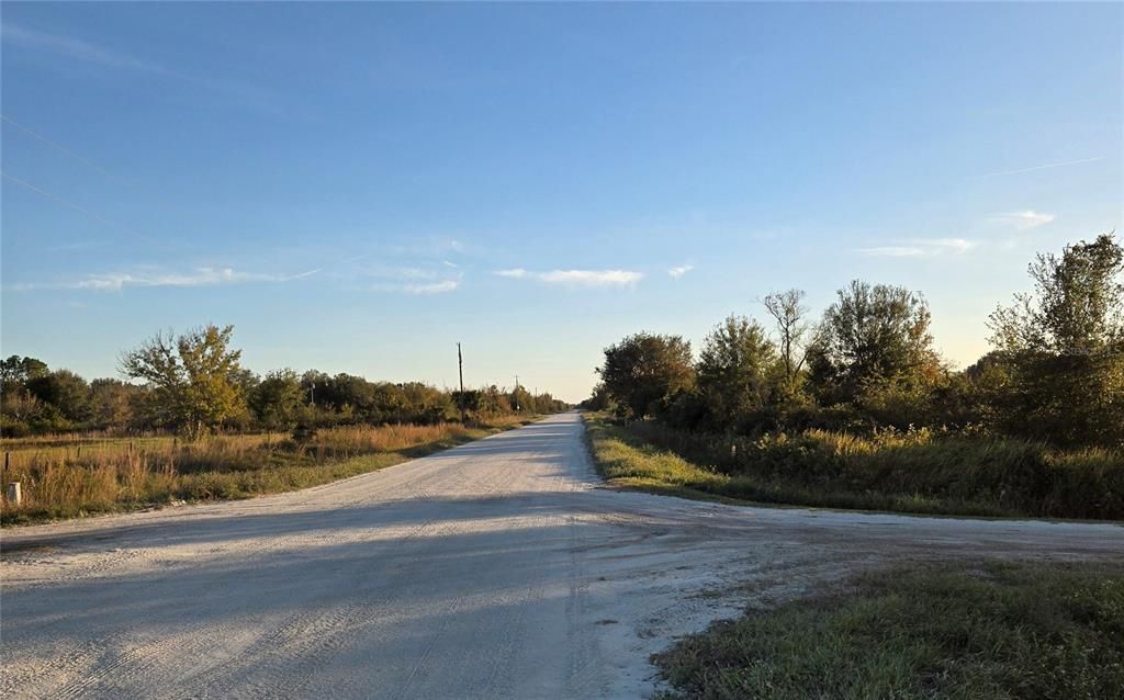 Facing South on NW 208th St. NW 274th St to the right (East)