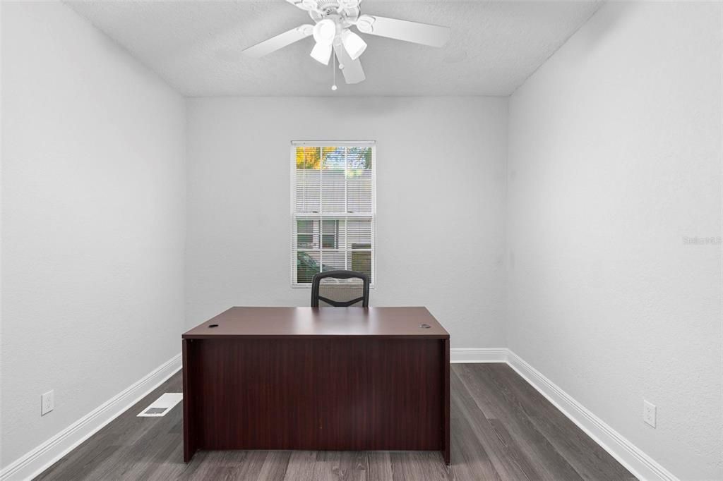 Second Office - First Floor – Second office space with ample lighting on the first floor.