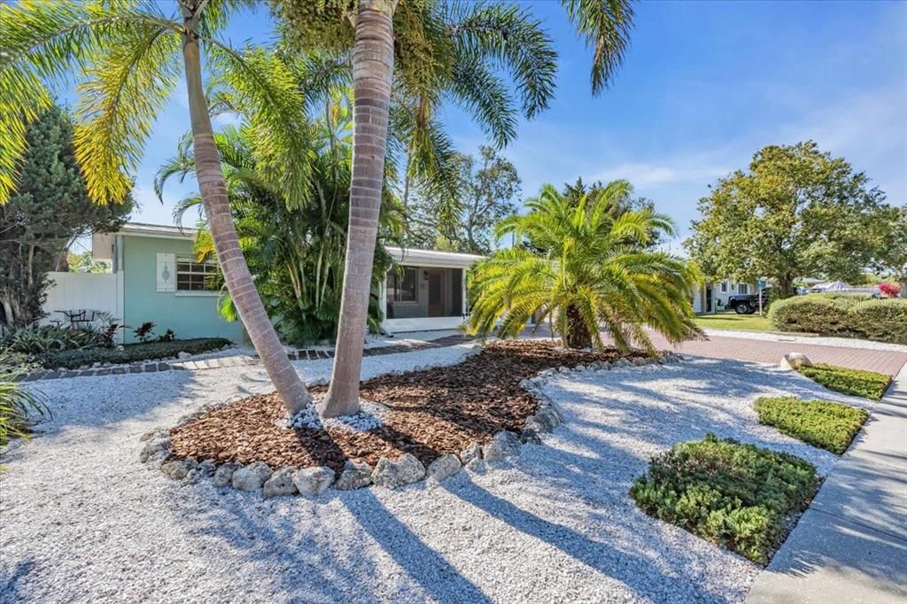 Coastal Ranch 3 miles from Madeira Beach. Landscaping with mature palm trees, paved driveway