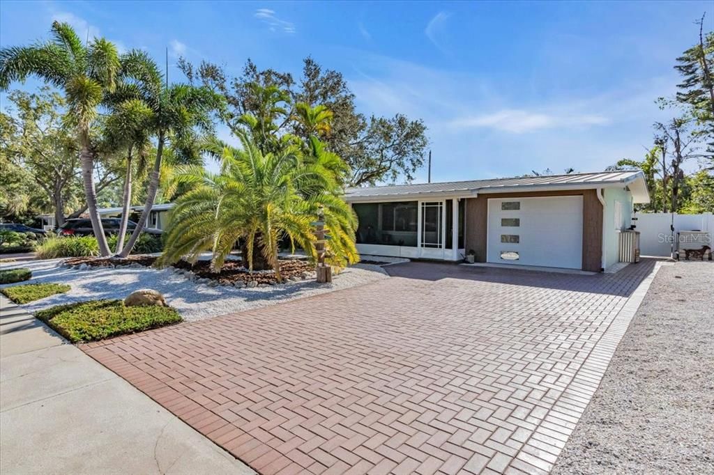 Paved double drive way and one car garage