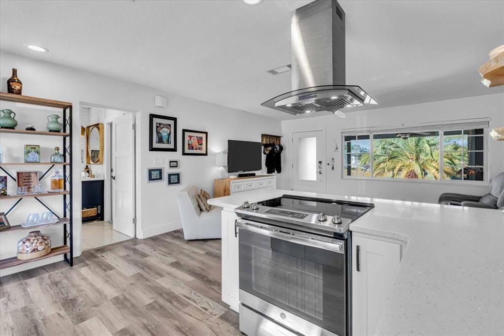 Open floor plan with bath and entrance to the garage