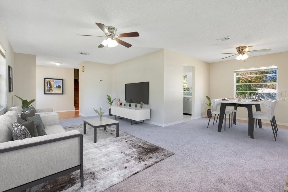 Virtually staged living room w/ Dining Room