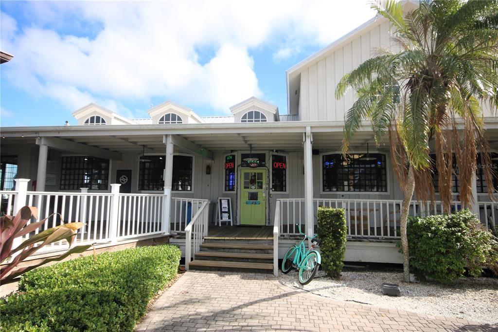 Couple shops by restaurant.