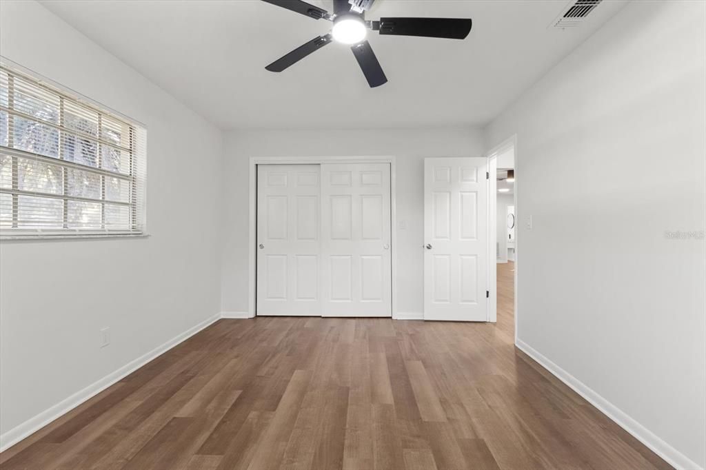 Master Bedroom w/ NEW Ceiling Fan & Bypass Closet Doors...NEW Interior Doors Throughout