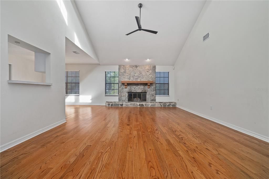 Living Room with high ceilings, stone fireplace