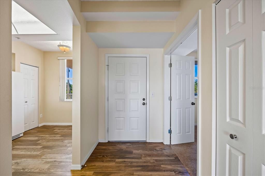 Front door entry with Kitchen on the left in photo and bedroom one to the right