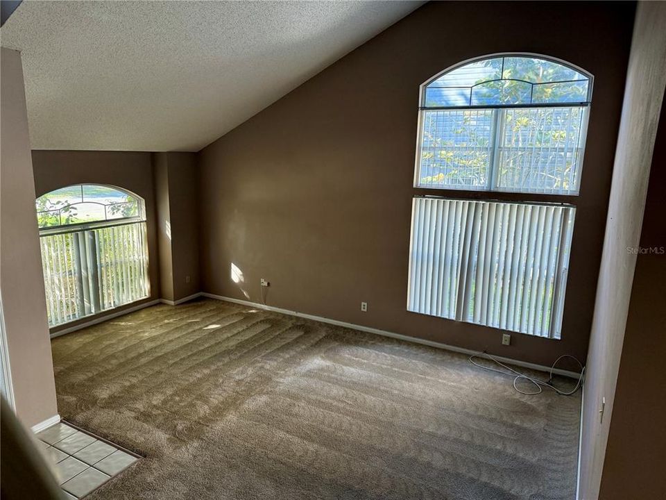 Fomal living/dining room combo as you enter the home with large windows for nice lighting