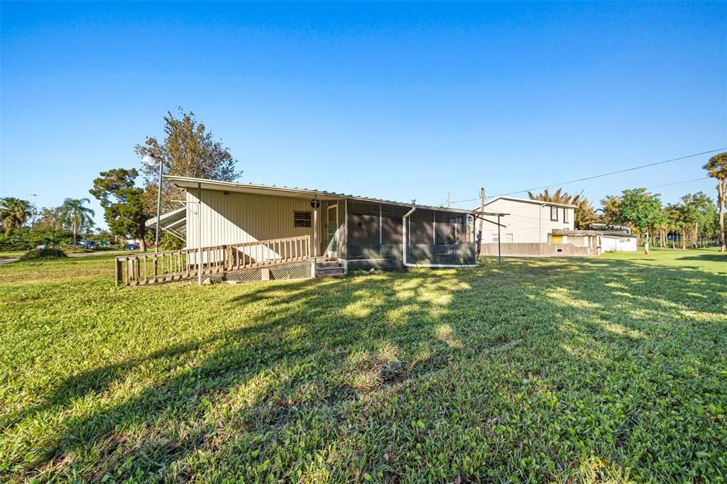 Carport collapsed during Hurricane Milton and virtually removed from this photo to show the property better.