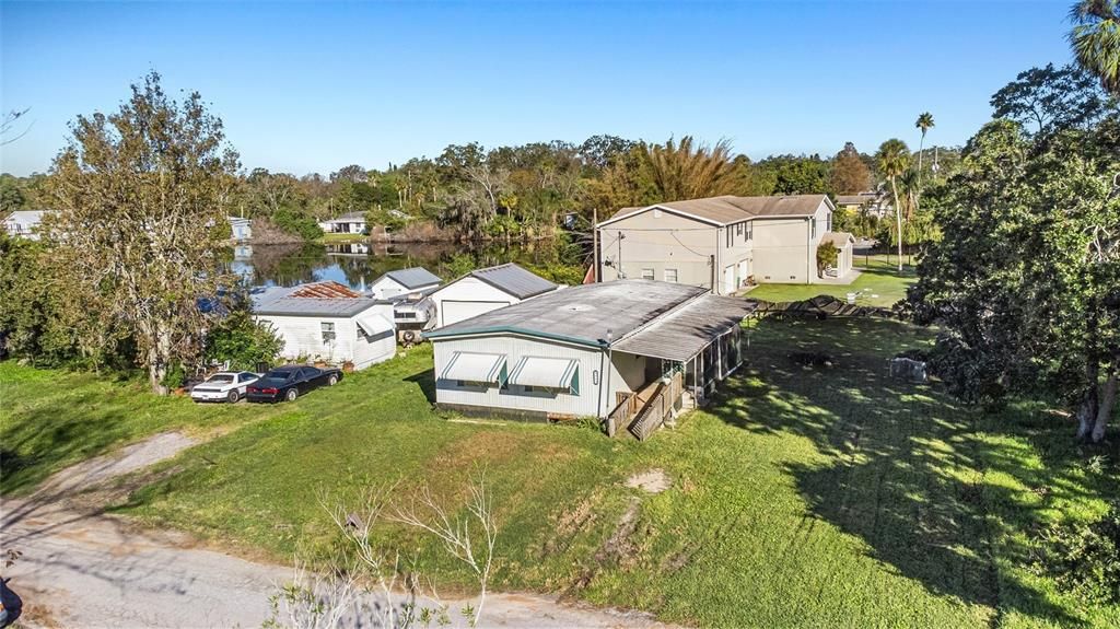 Stunning Property.  Carport collapsed during Hurricane Milton and virtually removed from this photo to show the property better.