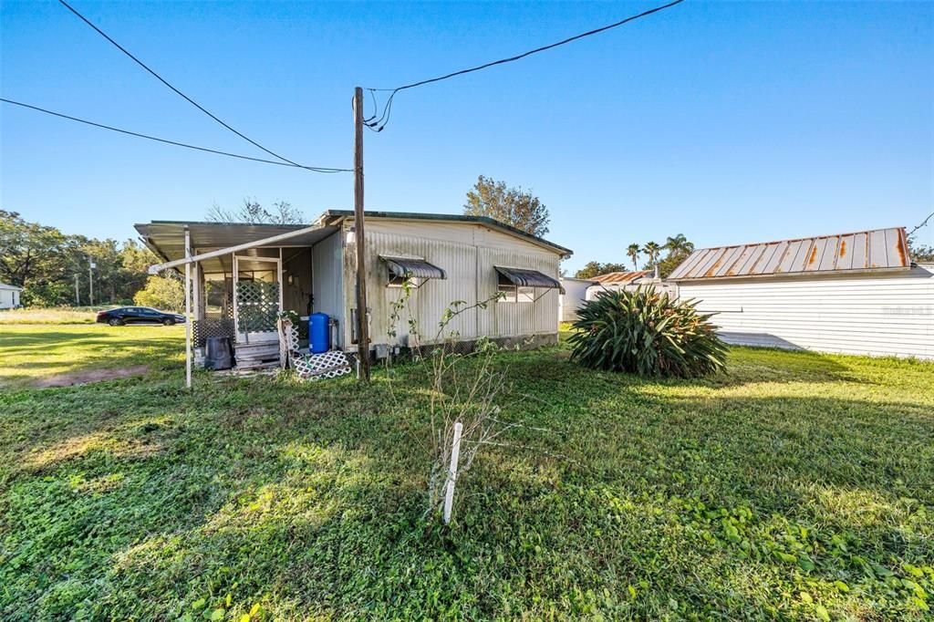 Carport collapsed during Hurricane Milton and virtually removed from this photo to show the property better.