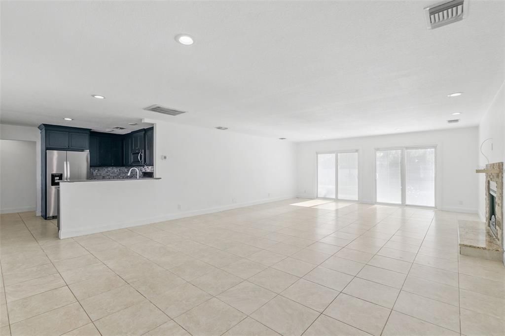 Large living room with French doors to backyard