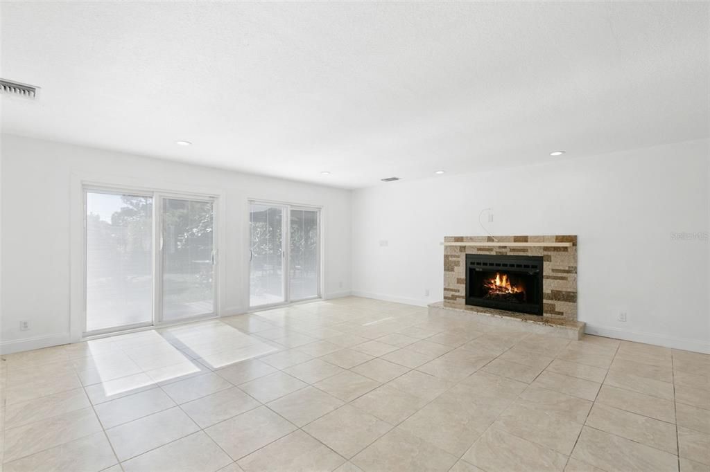 Living room with wood burning fireplace