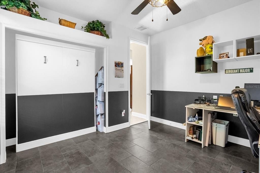 Fourth bedroom with built-in Murphy bed and office furniture that stays with home. This would also be a great guest room, because it has its own bathroom.