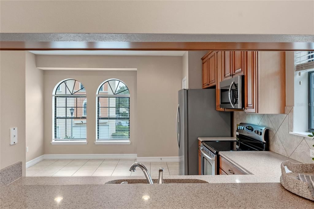 Kitchen bar through to eating area