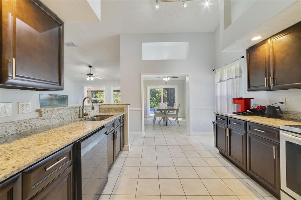 The family chef will appreciate the updated kitchen offering a great mix of cabinet and drawer storage, STAINLESS STEEL APPLIANCES and GRANITE COUNTERTOPS.