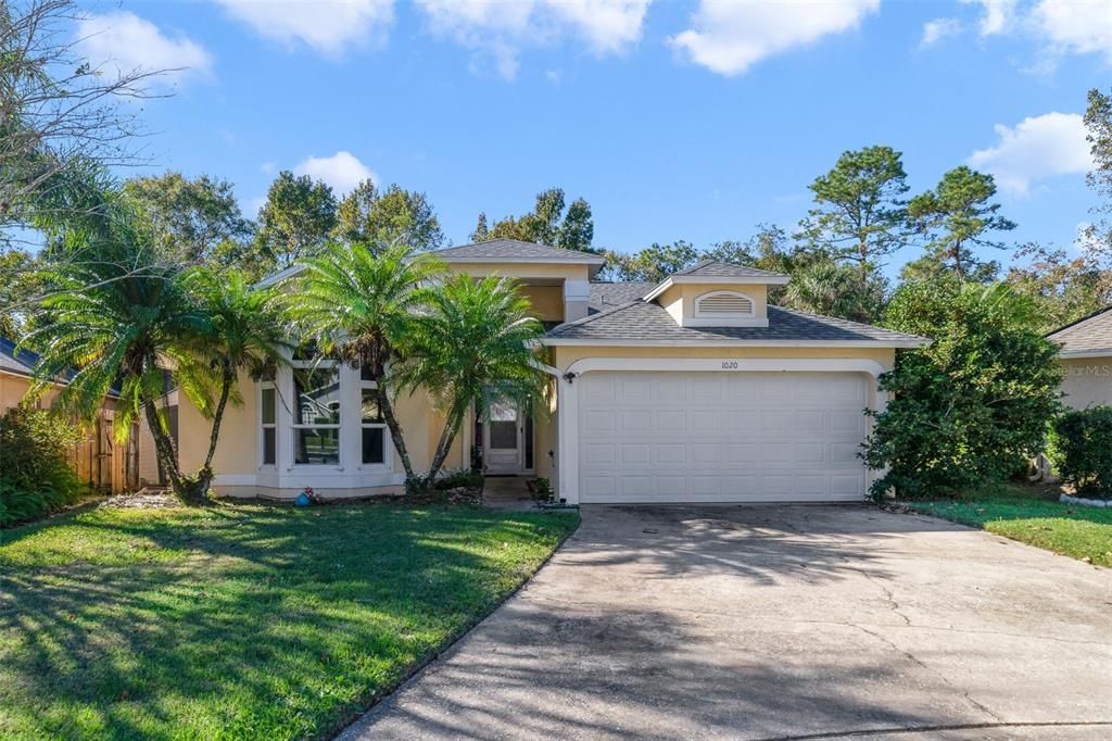 **WELCOME HOME** Nestled among the trees in the desirable Alafaya Woods community of Oviedo, this 3-bedroom, 2-bath POOL HOME is perfectly situated on a large .19 ACRE CUL-DE-SAC LOT with OWNED SOLAR PANELS, a NEW ROOF (2023), UPDATED KITCHEN & PRIMARY BATH and CONSERVATION VIEWS!