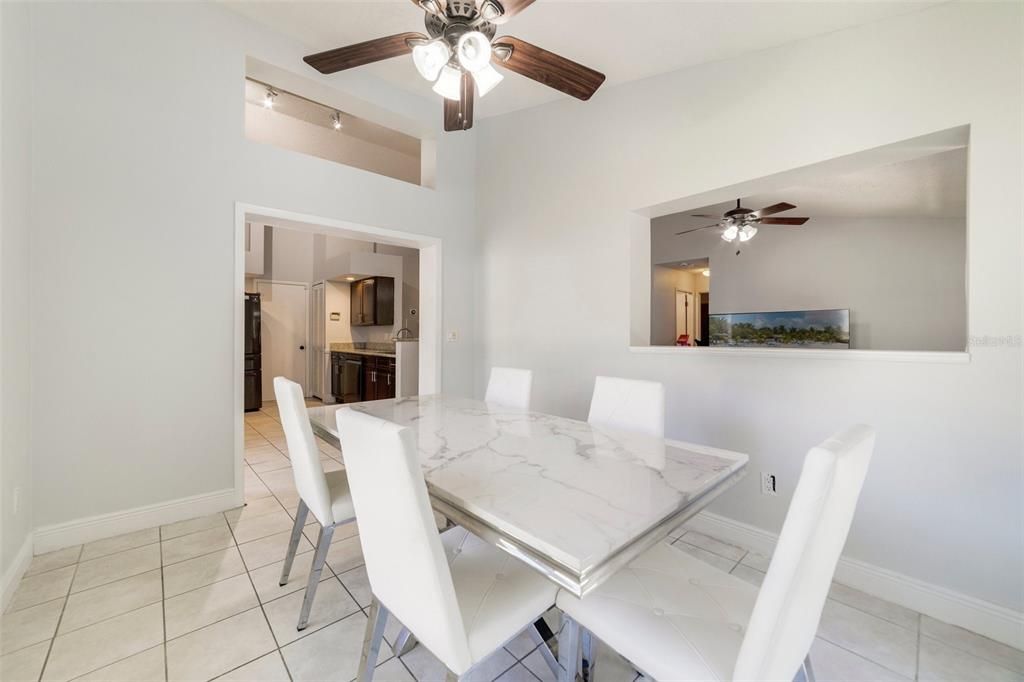 Off the kitchen there is a FLEX ROOM, currently being utilized as a formal dining area, with a large picture window in addition to sliding glass doors that open up to your SCREENED POOL