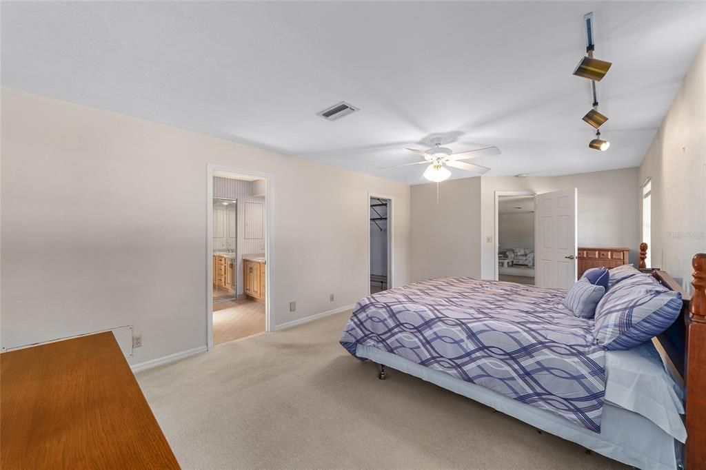 Large, true walk in closet with 2 & 3 tier shelving .