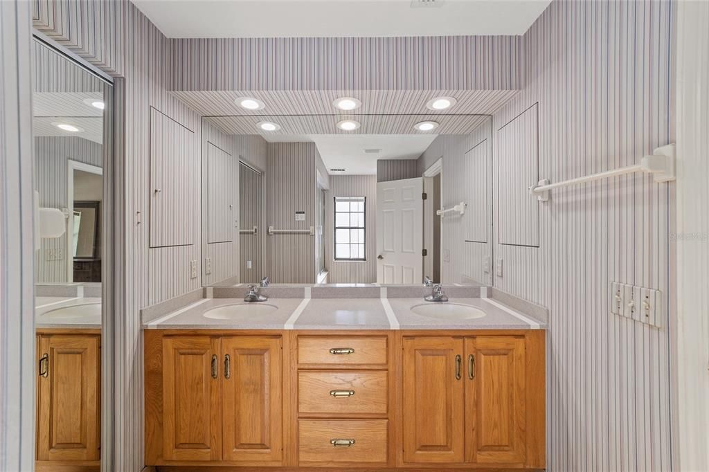 Dual vanities, solid surface counters, Custom shower with Deep Soaking tub with Jacuzzi jets.