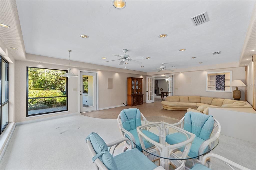 Welcome to your Florida sunroom with panoramic views of camellia's Azaleas granddaddy Live Oaks Jasmine flower beds &  fruit tree. Amazingly backs up to three acre common ground means no rear neighbors ever. Truly private.