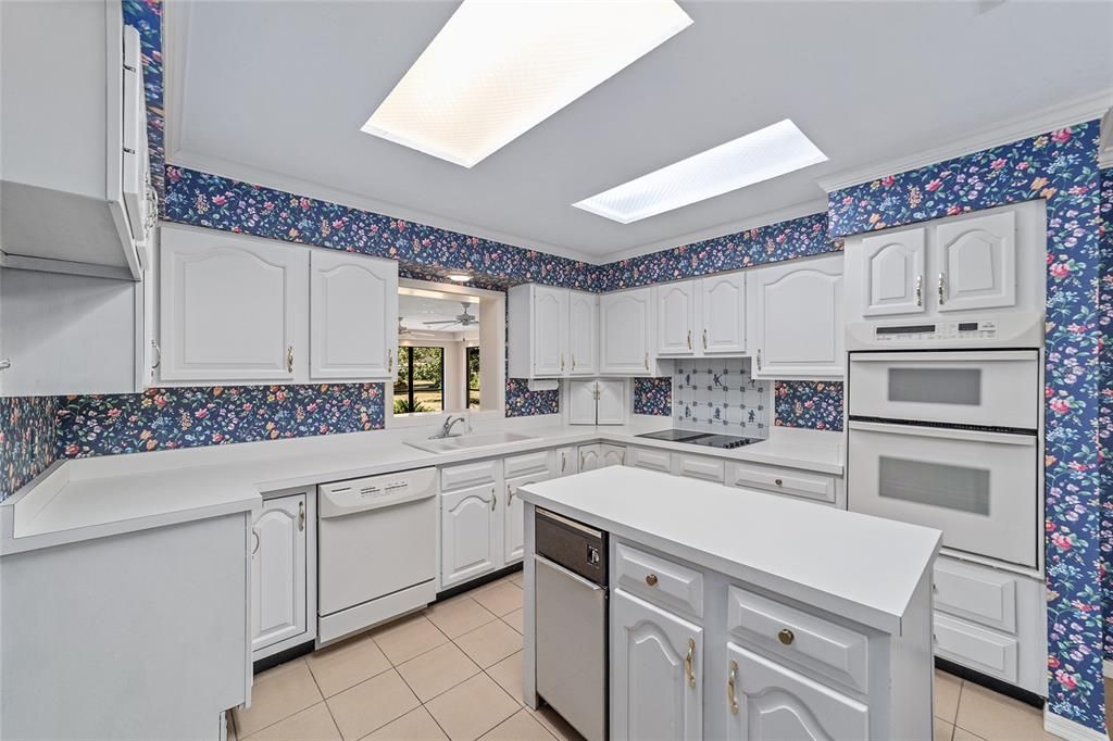 A kitchen for the Chef. Built in Oven, Glass Top Range, Ice maker hook up in the island or add wine cooler instead.