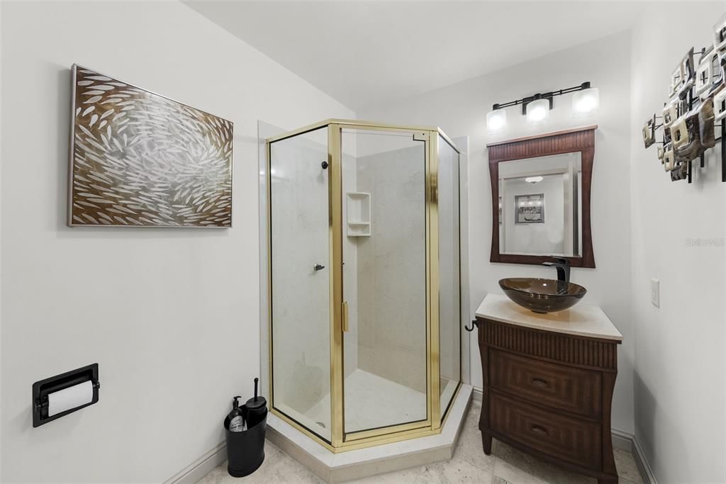 Middle downstairs bathroom with walk in shower