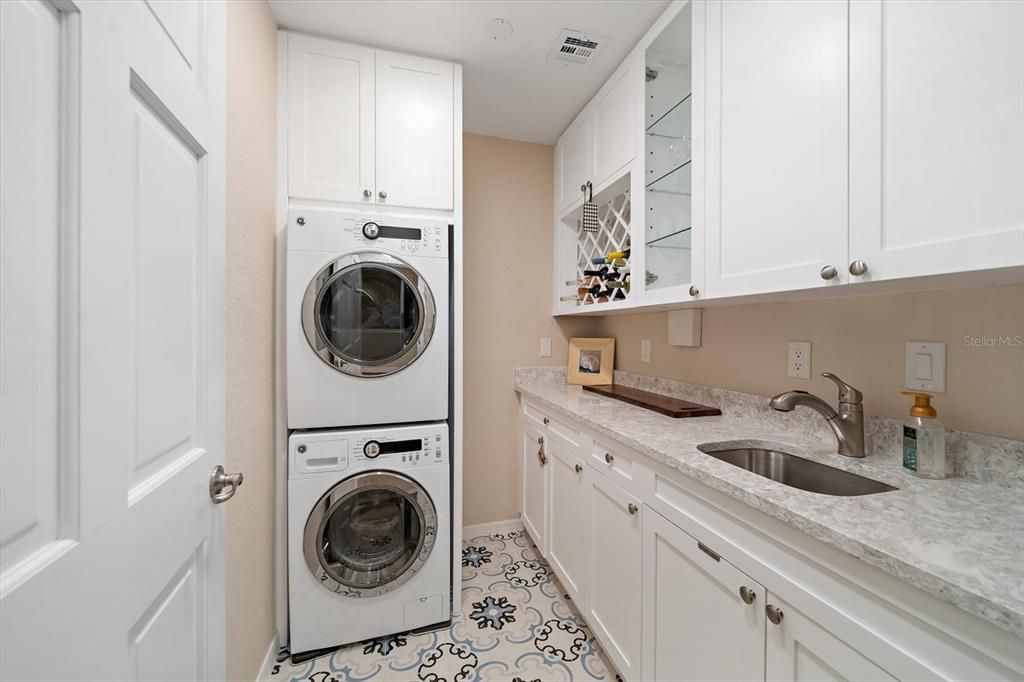 Laundry area has notable space and very attractive built-ins.