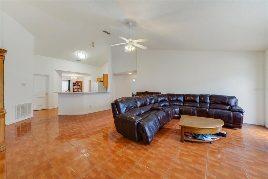 In the perfect location for easy access to shopping, dining and Florida’s Turnpike the new owner of this home will enjoy a large .26 ACRE LOT, tile and VINYL PLANK WOOD FLOORS throughout, HIGH CEILINGS and a NEW ROOF is in process.