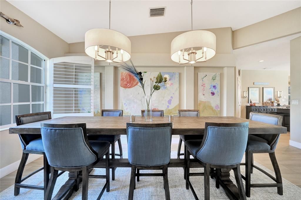 Spectacular space for any size family in this dining area. Windows with plantation shutters