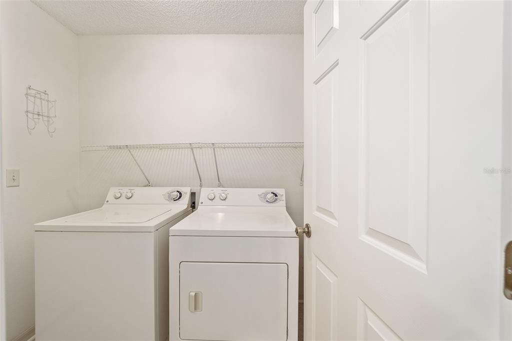 laundry area off primary bedroom