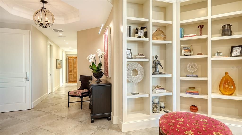 Fabulous entry enhanced with built-in to show your treasures.