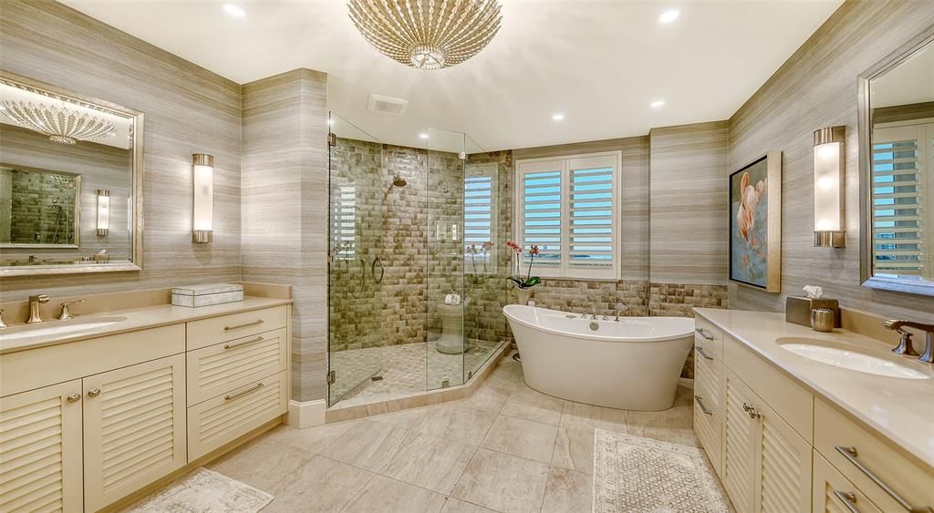 Spacious spa-inspired bath, soaking tub, large shower, separate vanities. Enhanced lighting, great storage, fabulous wallpaper.