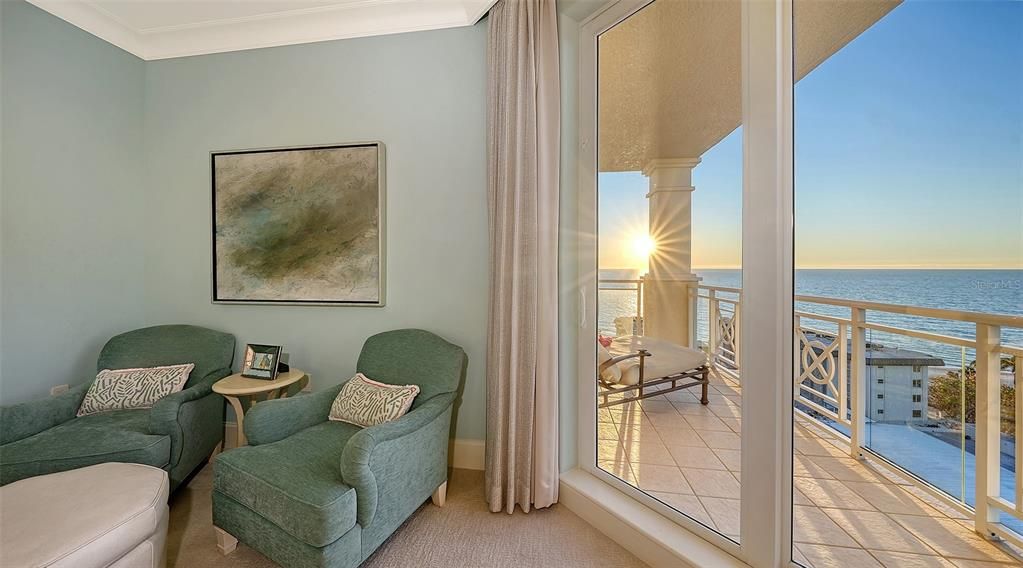 Comfortable seating in the primary bedroom, terrace with Gulf views.