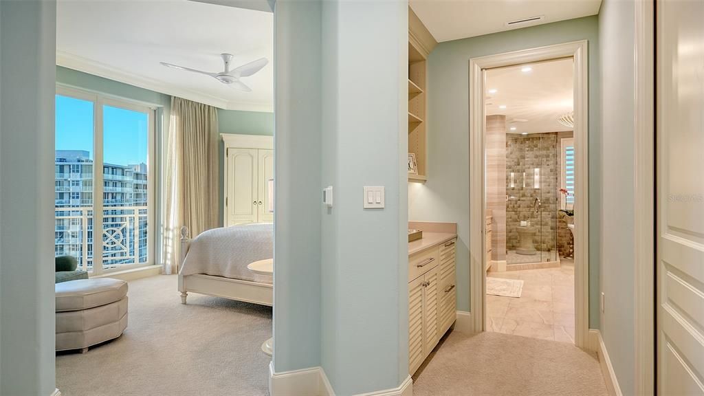 Double doors lead to the primary suite, 2 outfitted walk-in closets, morning bar, spa inspired bathroom and comfortable bedroom.